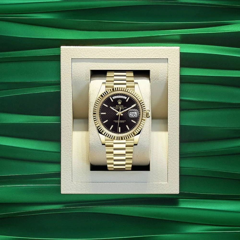 Rolex Day Date 40mm - Ref: 228238-0007 - Black Diagonal Motif Dial & Fluted Bezel, 18K Yellow Gold President Bracelet Men's Watch